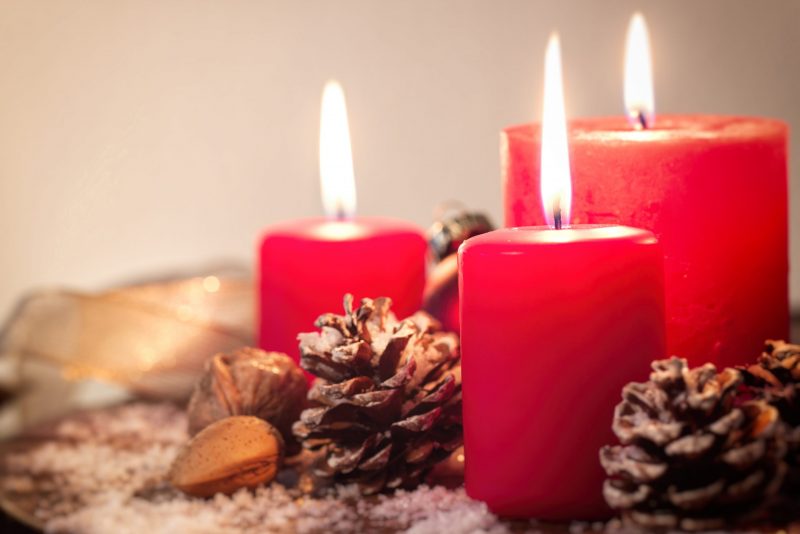 Christmas candles with christmas decorations, christmas or new year atmosphere, selective focus, horizontal